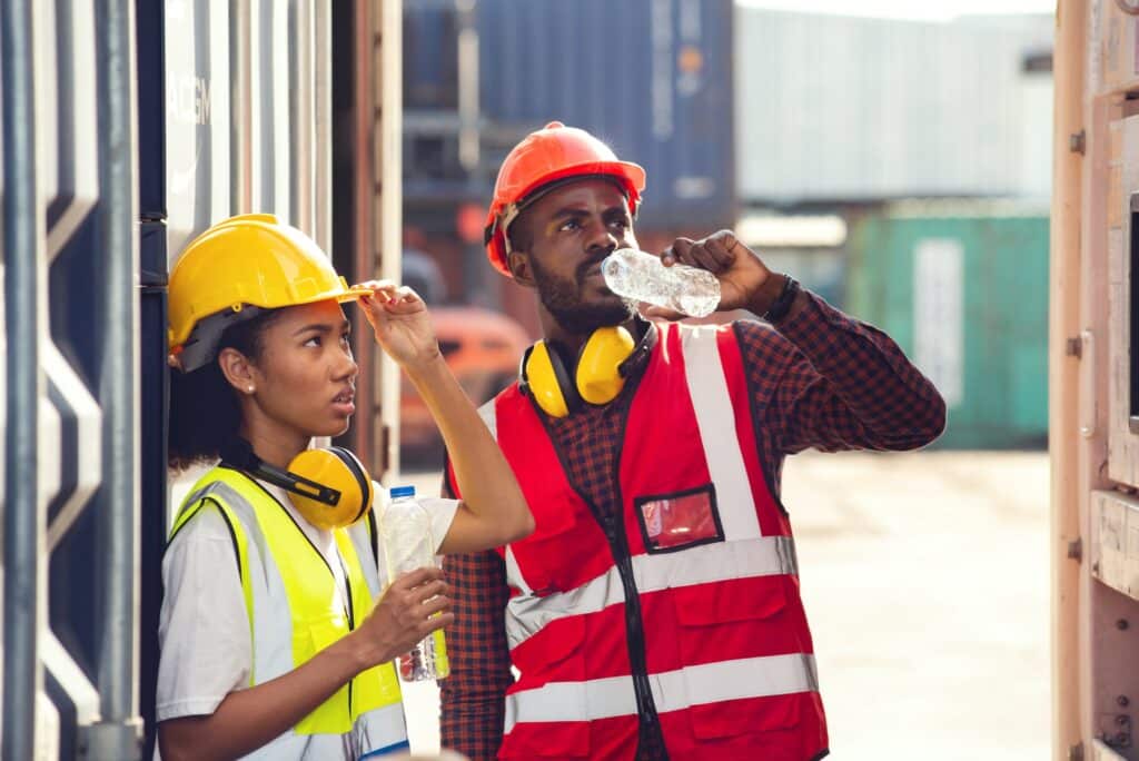 construction workrs hudrating and taking a break due to temperatures shown on their data logger with sample rate